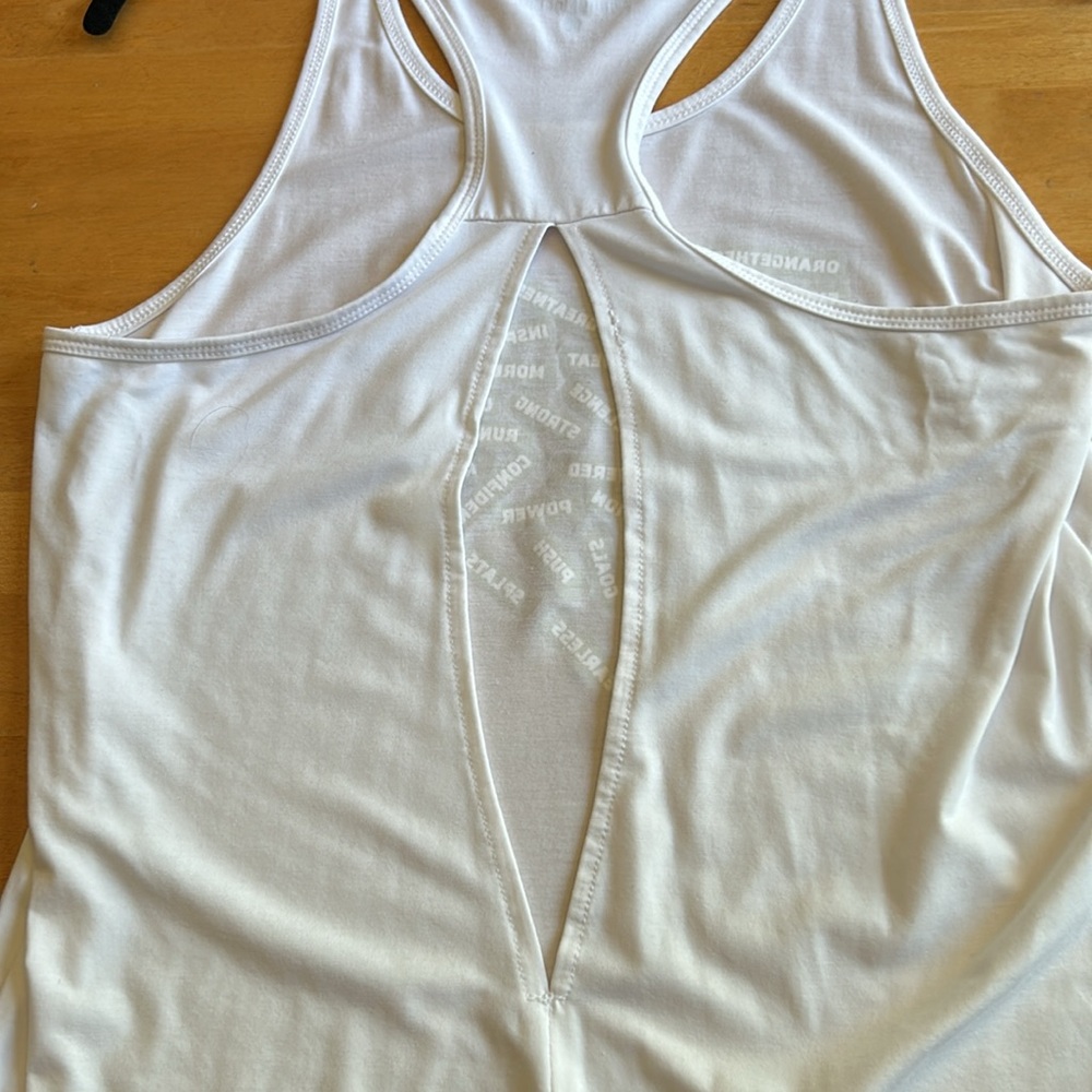 Orangetheory white tank with gold lettering and open slit in back - Picture 9 of 9
